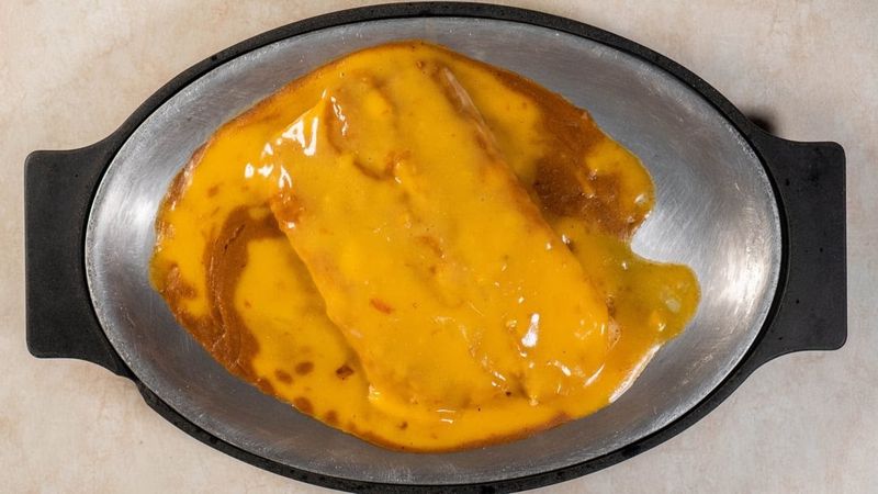 Enchiladas Swimming in Sauce and Cheese Enchiladas Swimming in Sauce and Cheese