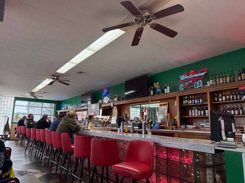 Green Railroad Posts And Indy 500 Trinkets Make The Room Feel Like Home