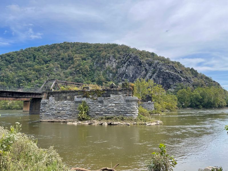 Old Bridge Piers With Stories Still Standing In The Current