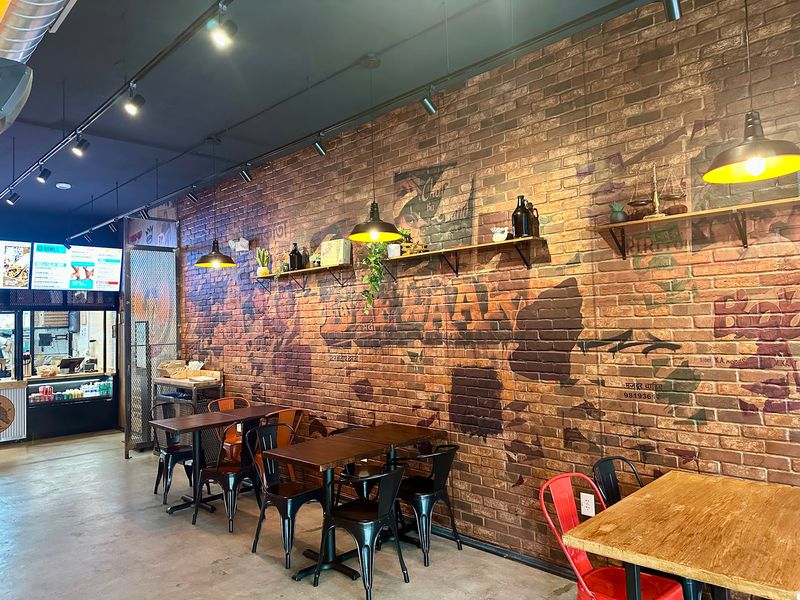 Orange Walls And Murals Make Lunch Feel Like A Trip