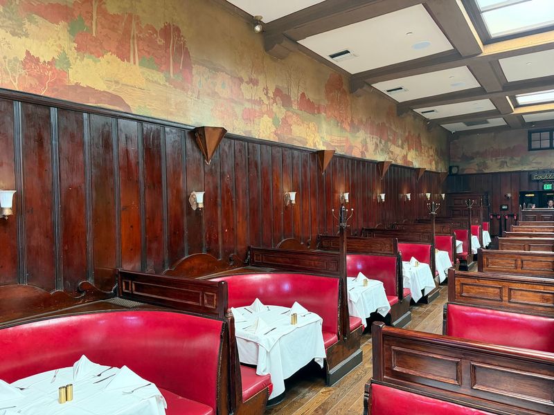 Red Booths, Dark Wood, and a Lot of Charm