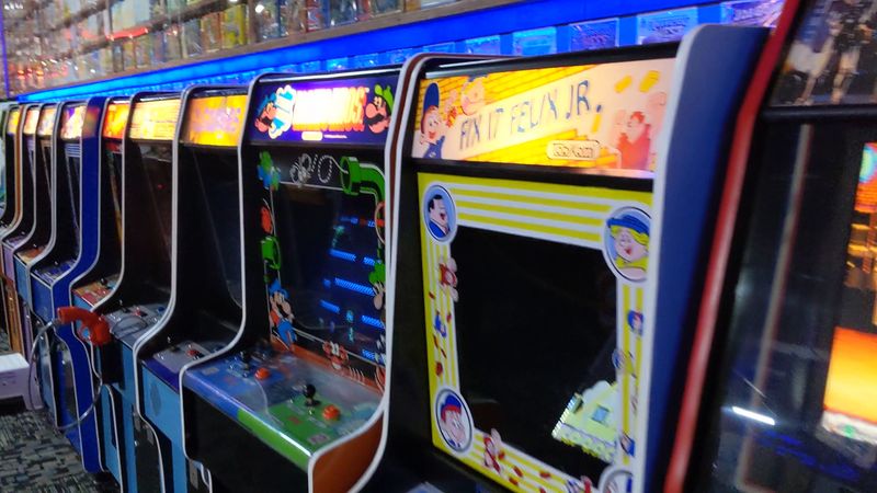 Retro Cabinets And Modern Racers Share The Same Glowing Floor