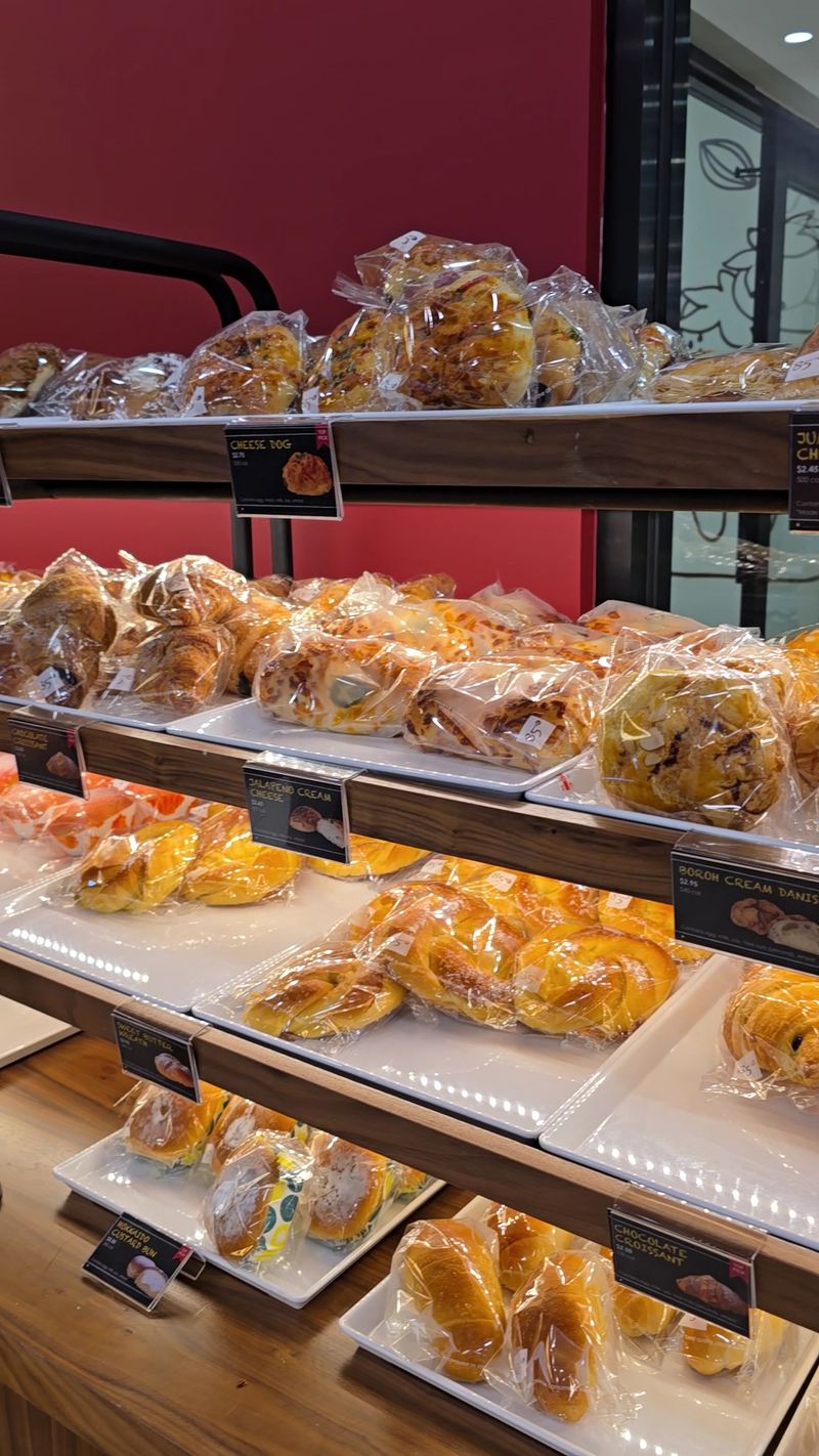 Shelves Stacked With Golden Breads and Buns
