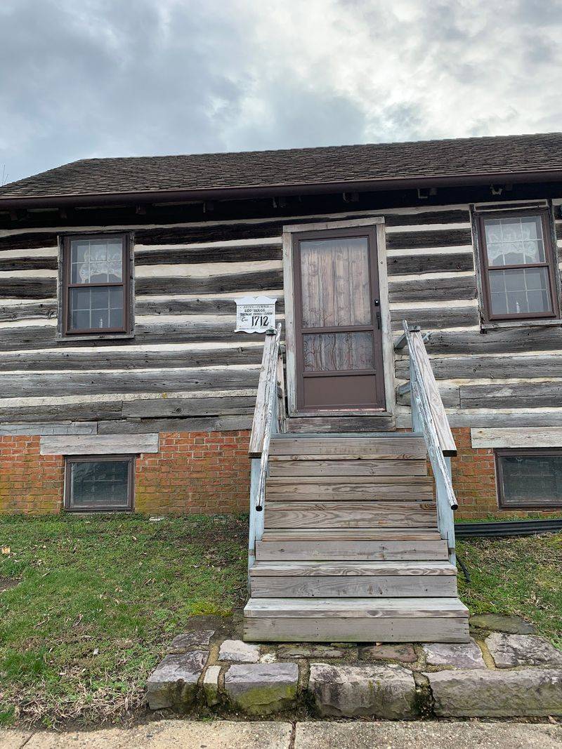 Somebody Found a Whole Log House Hiding Inside Another Home
