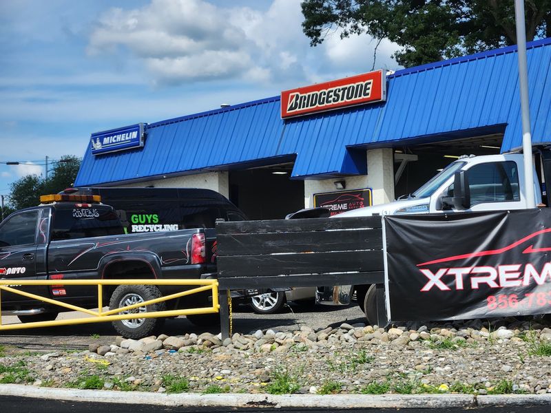 Still a Real Tire Shop Behind Her