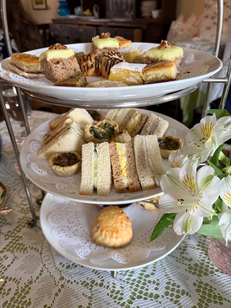 Three Tiers of Tiny Treats Await Your Table Three Tiers of Tiny Treats Await Your Table